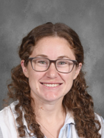 Patricia Fox is wearing a white shirt.