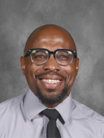 Ernest Patrick African American man with dress shirt and black tie