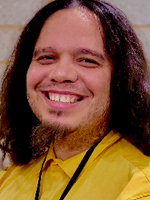 Damien Christopher Warsavage is wearing a yellow shirt